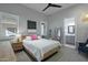Comfortable bedroom with a bed, nightstand, and en-suite bathroom access at 14821 E Chandler Heights Rd, Chandler, AZ 85249
