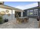 Outdoor patio with seating area, dining table, and decorative wall art at 14821 E Chandler Heights Rd, Chandler, AZ 85249