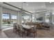 Open dining room with a large table and access to the backyard at 14821 E Chandler Heights Rd, Chandler, AZ 85249