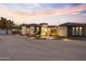 Stunning curb appeal with a welcoming entrance and landscape lighting at 14821 E Chandler Heights Rd, Chandler, AZ 85249
