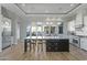 Modern kitchen with a large island and stainless steel appliances at 14821 E Chandler Heights Rd, Chandler, AZ 85249