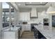 Spacious kitchen with granite countertops and stainless steel appliances at 14821 E Chandler Heights Rd, Chandler, AZ 85249