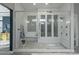 Large walk-in shower with multiple shower heads and built-in seating at 14821 E Chandler Heights Rd, Chandler, AZ 85249