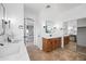 Double vanity bathroom with modern fixtures and a view into bedroom at 14866 W Windsor Ave, Goodyear, AZ 85395