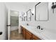 Modern bathroom with double vanity and updated fixtures at 14866 W Windsor Ave, Goodyear, AZ 85395