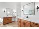 Double vanity bathroom with white countertops and wood cabinets at 14866 W Windsor Ave, Goodyear, AZ 85395