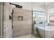 Large walk-in shower with modern fixtures and gray tile at 14866 W Windsor Ave, Goodyear, AZ 85395