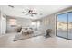 Spacious primary bedroom with light flooring and access to balcony at 14866 W Windsor Ave, Goodyear, AZ 85395