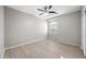Spacious bedroom with large window and ceiling fan at 14866 W Windsor Ave, Goodyear, AZ 85395
