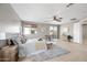 Bright and airy primary bedroom with a plush bed and sliding door access at 14866 W Windsor Ave, Goodyear, AZ 85395