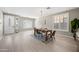 Bright dining room with hardwood floors and a modern chandelier at 14866 W Windsor Ave, Goodyear, AZ 85395