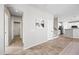 Bright entryway with tile floors, view into kitchen, and doors to other rooms at 14866 W Windsor Ave, Goodyear, AZ 85395