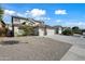 Two-story house with a three-car garage and desert landscaping at 14866 W Windsor Ave, Goodyear, AZ 85395