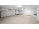 Spacious two-car garage with light-colored flooring and automatic garage door openers at 14866 W Windsor Ave, Goodyear, AZ 85395