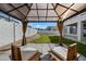 Covered gazebo with seating, providing shade in the backyard at 14866 W Windsor Ave, Goodyear, AZ 85395