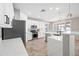 Modern kitchen with white cabinets, quartz countertops, and island at 14866 W Windsor Ave, Goodyear, AZ 85395