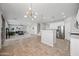 Open concept kitchen with living room view and island at 14866 W Windsor Ave, Goodyear, AZ 85395