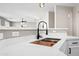 Modern kitchen with a farmhouse sink and black faucet at 14866 W Windsor Ave, Goodyear, AZ 85395