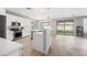 Modern kitchen with white cabinets and quartz countertops at 14866 W Windsor Ave, Goodyear, AZ 85395