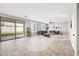 Open living room with hardwood floors and access to backyard at 14866 W Windsor Ave, Goodyear, AZ 85395