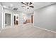 Open loft area with wood-look floors and access to bathroom at 14866 W Windsor Ave, Goodyear, AZ 85395