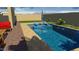 Stunning pool with patio furniture and landscaping at 14866 W Windsor Ave, Goodyear, AZ 85395