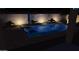 Inviting backyard pool with lounge chairs and umbrella at 14866 W Windsor Ave, Goodyear, AZ 85395