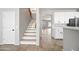 Modern staircase leading to the upper level of the home at 14866 W Windsor Ave, Goodyear, AZ 85395