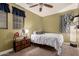 Cozy bedroom with ceiling fan and ample closet space at 15244 W Alexandria Way, Surprise, AZ 85379