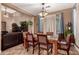 Spacious dining room with hardwood floors and view of living room at 15244 W Alexandria Way, Surprise, AZ 85379