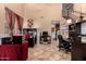Bright home office with built-in shelving and hardwood floors at 15244 W Alexandria Way, Surprise, AZ 85379