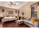 Main bedroom with sitting area and hardwood floors at 15244 W Alexandria Way, Surprise, AZ 85379