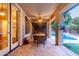 Outdoor patio with dining area and pool view at 15244 W Alexandria Way, Surprise, AZ 85379