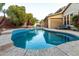 Inviting kidney-shaped pool with surrounding landscaping at 15244 W Alexandria Way, Surprise, AZ 85379