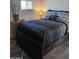 Bedroom with a dark wooden bed frame and gray bedding at 156 N Hawes Rd # 75, Mesa, AZ 85207