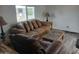 Living room with brown sofa and recliner at 156 N Hawes Rd # 75, Mesa, AZ 85207