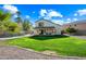 Expansive grassy backyard with a view of the house and surrounding landscape at 16238 N 161St Dr, Surprise, AZ 85374