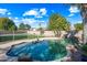 Sparkling kidney-shaped pool with rock waterfall at 16238 N 161St Dr, Surprise, AZ 85374