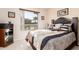 Guest bedroom with window and decorated bed at 16983 W Desert Blossom Way, Surprise, AZ 85387