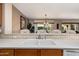 Kitchen sink with double basin and tiled backsplash at 16983 W Desert Blossom Way, Surprise, AZ 85387