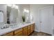 Double vanity bathroom with light wood cabinets, quartz countertops, and modern fixtures at 17421 E Via Del Oro --, Fountain Hills, AZ 85268
