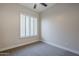 Well-lit bedroom featuring gray carpet and plantation shutters at 17421 E Via Del Oro --, Fountain Hills, AZ 85268