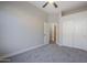 Bedroom with ceiling fan, carpet, double doors to closet, and door to bathroom at 17421 E Via Del Oro --, Fountain Hills, AZ 85268