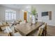 Bright dining room featuring a rustic wood table and neutral decor at 17421 E Via Del Oro --, Fountain Hills, AZ 85268
