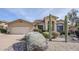 Tan house with a two-car garage and desert landscaping at 17421 E Via Del Oro --, Fountain Hills, AZ 85268