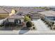 Aerial view of single story home with two car garage and landscaping at 17531 W Liberty Ln, Goodyear, AZ 85338