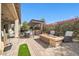 Outdoor entertaining area with pergola, dining table, and fire pit at 17531 W Liberty Ln, Goodyear, AZ 85338