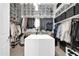 Custom walk-in closet with ample shelving and hanging space at 17531 W Liberty Ln, Goodyear, AZ 85338