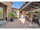Relaxing courtyard with fireplace, seating area, and pergola at 17531 W Liberty Ln, Goodyear, AZ 85338
