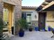 Charming courtyard with blue pots and a stone-accented wall at 17531 W Liberty Ln, Goodyear, AZ 85338
